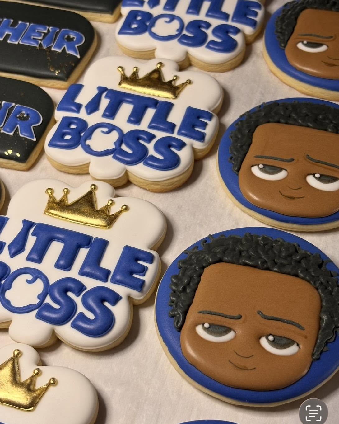 Little Boss first birthday cookies with crowns and a baby face